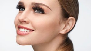 Beautiful Smiling Girl With Beauty Makeup And Long Eyelashes